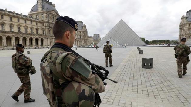 French army soldiers patrol near the Louvre Museum Pyramid’s main entrance in Paris, France(Reuters) French army soldiers patrol near the Louvre Museum Pyramid’s main entrance in Paris, France(Reuters)