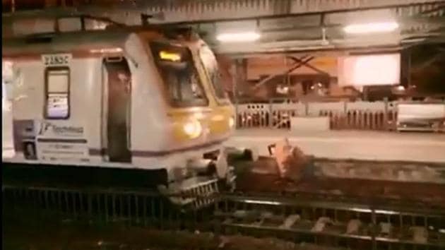 The videograb shows motorman applying brakes while the woman was still climbing a platform at Charni Road station in Mumbai.(HT PHOTO)