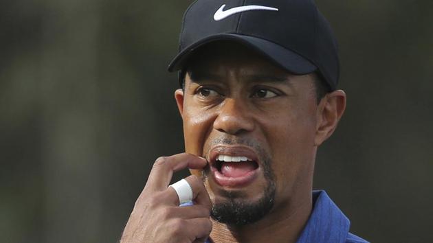 Tiger Woods has withdrawn from the Dubai Desert Classic tournament but his manager reiterated that he has luckily not suffered a nerve injury on his back which kept him out of action for close to 15 months.(AP)
