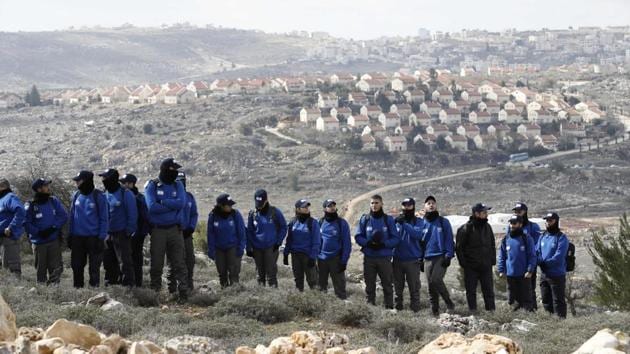 File photo from February 1, 2017 shows Israeli security forces gather at Amona outpost, northeast of Ramallah, as they prepare to evict hardline Jewish occupants of the wildcat settlement outpost in line with a high court ruling that determined the homes were built on private Palestinian land. (AFP) File photo from February 1, 2017 shows Israeli security forces gather at Amona outpost, northeast of Ramallah, as they prepare to evict hardline Jewish occupants of the wildcat settlement outpost in line with a high court ruling that determined the homes were built on private Palestinian land. (AFP)
