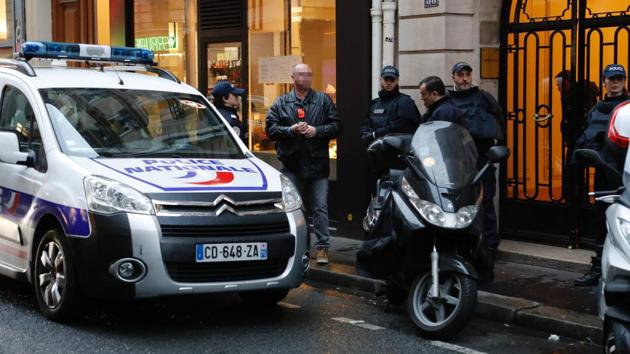 French police stand on a sidewalk as a search is conducted in Paris' 8th arrondissement as part of the investigation into the attack at the Louvre museum earlier on Friday. (AFP) French police stand on a sidewalk as a search is conducted in Paris' 8th arrondissement as part of the investigation into the attack at the Louvre museum earlier on Friday. (AFP)