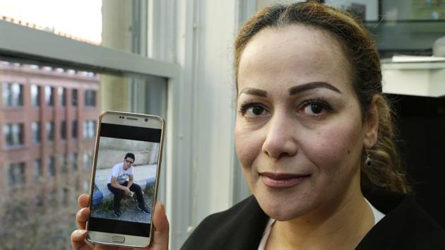 Reema Duhman in Seattle shows a photo of her son stuck in Syria.(AP photo) Reema Duhman in Seattle shows a photo of her son stuck in Syria.(AP photo)