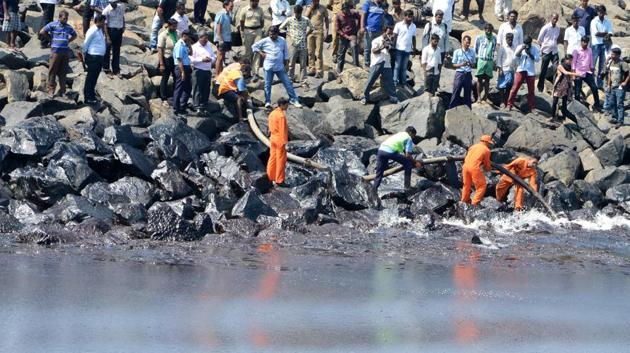 The Coast Guard Pollution Response Team tackles the oil spill in the sea at Ernavoor. Over 1,000 personnel from various government departments were involved in the clean-up of the shoreline. 