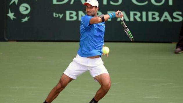 India's Yuki Bhambri returns a shot during his Davis Cup singles match against New Zealand's Finn Tearney at the Balewadi Sports Complex in Pune.(AFP)