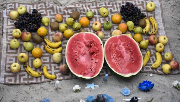 Offerings for the African sea goddess Yemanja are arranged on a towel at a beach in Montevideo, Uruguay, Thursday, Feb. 2, 2017. Thousands of worshippers come to the beach on Yemanja's feast day, bearing candles, flowers, perfumes and fruit to show their gratitude for her blessings. The celebration coincides with the Roman Catholic feast day of the Virgin of Candelaria, marked Feb. 2. (Matilde Campodonico / AP)