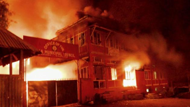 Naga tribals set ablaze the Kohima Municipal Council office and the office of the district collector to protest against chief minister TR Zeliang's refusal to meet their ultimatum, in Kohima.(PTI Photo)