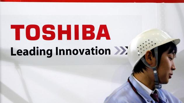 File photo of an employee standing next to a logo of Toshiba Corp in Yokohama, south of Tokyo, in November 2012. (Reuters) File photo of an employee standing next to a logo of Toshiba Corp in Yokohama, south of Tokyo, in November 2012. (Reuters)