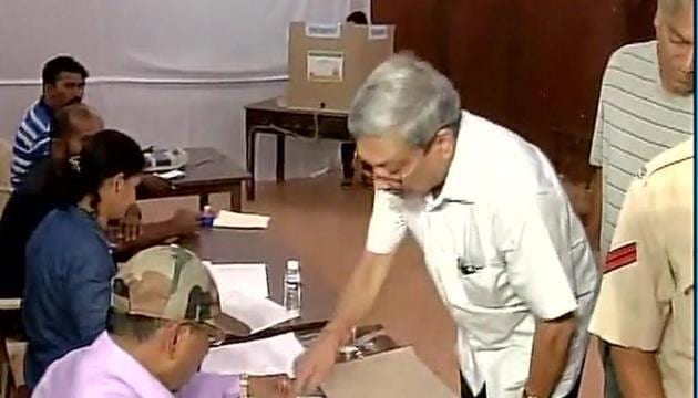 Defence minister Manohar Parrikar casts his vote at a polling station in Goa’s Panaji.(Twitter/@ANI_News)