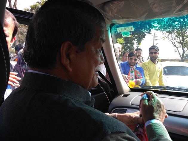 Chief minister Harish Rawat during a roadshow in Jaspur constituency.(Anupam Trivedi/HT Photo)
