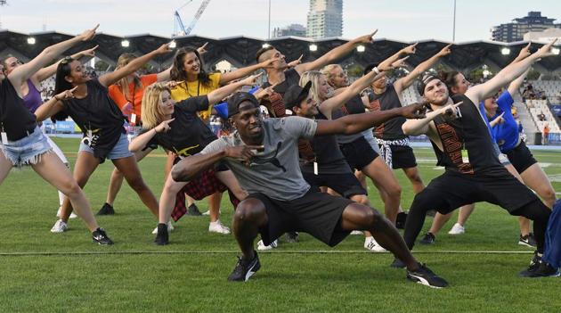 Usain Bolt entertains the crowd before the start of the Nitro Athletics meet in Melbourne on Saturday.(AP)