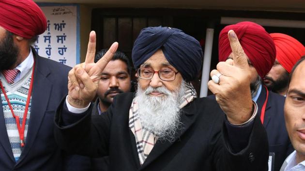 Punjab chief minister Parkash Singh Badal showing victory signs after casting his vote in Badal village on Saturday. (Sanjeev Kumar/HT photo)
