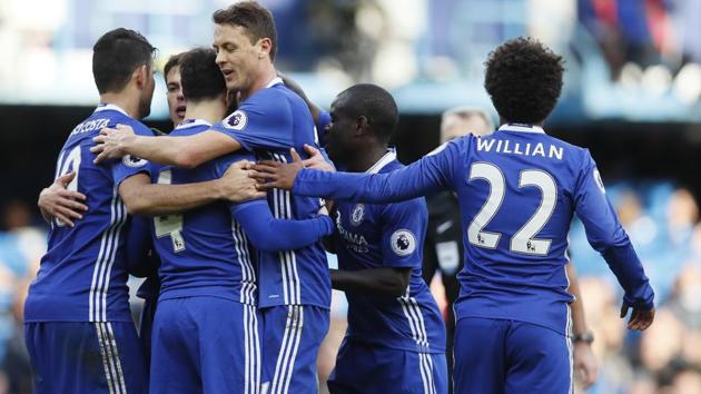 Chelsea FC's Cesc Fabregas, second left is mobbed by his teammates after scoring against Arsenal Football Club in Premier League.(AP) Chelsea FC's Cesc Fabregas, second left is mobbed by his teammates after scoring against Arsenal Football Club in Premier League.(AP)