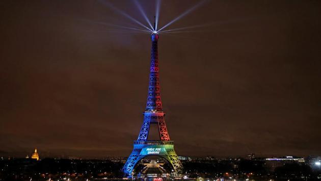 The Eiffel Tower is lit in the colours of the Olympic flag during the launch of the international campaign for the Paris bid to host the 2024 Olympic Games. (Benoit Tessier / REUTERS)