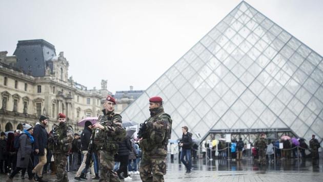 French soldiers patrol in the courtyard of the Louvre museum in Paris. (AP Photo) French soldiers patrol in the courtyard of the Louvre museum in Paris. (AP Photo)