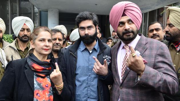 Congress candidate Navjot Singh Sidhu with his wife Navjot Kaur Sidhu and son Karan Sidhu after casting their votes at SR Government College in Amritsar on Saturday. (Sameer Sehgal/HT Photo)