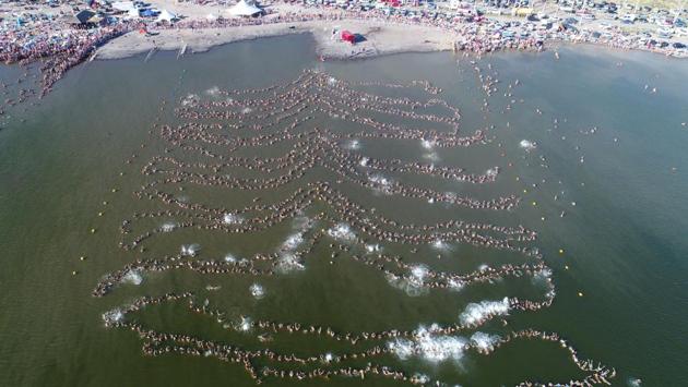 Nearly 2,000 people float in a line setting a new Guinness world record for the most people floating while holding hands in Lake Epecuen, a salty lake, near Carhue, Argentina. (REUTERS)