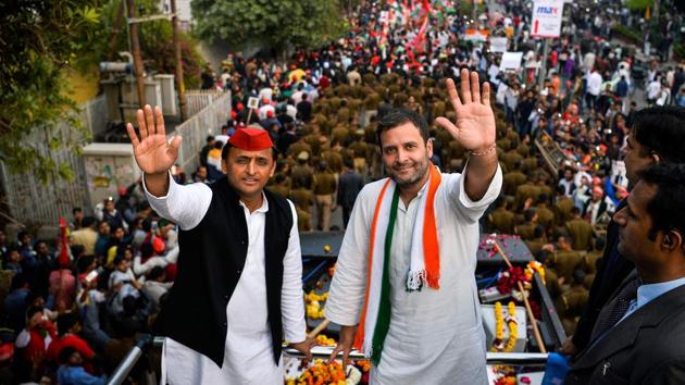 Congress party vice-president Rahul Gandhi and Uttar Pradesh state chief minister Akhilesh Yadav wave during a joint election rally with in Agra on Friday.(AFP)