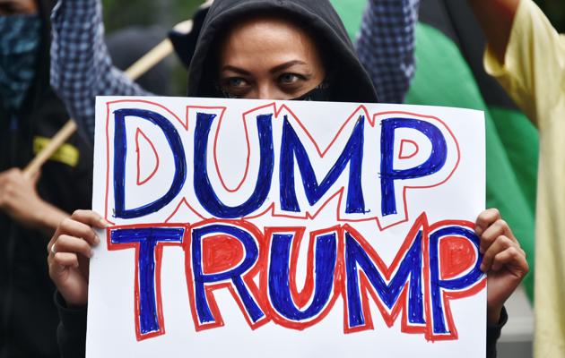 An Indonesian protester displays a placard during a rally against US President Donald Trump's executive order on immigration in front of the US embassy in Jakarta on February 4. (AFP) An Indonesian protester displays a placard during a rally against US President Donald Trump's executive order on immigration in front of the US embassy in Jakarta on February 4. (AFP)