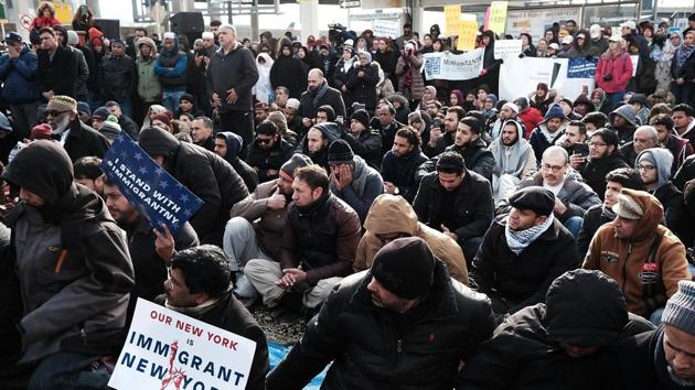 Protesters demonstrate against President Donald Trump's executive order banning immigrants and refugees from seven Muslim-majority countries at JFK airport in New York City. (AFP)