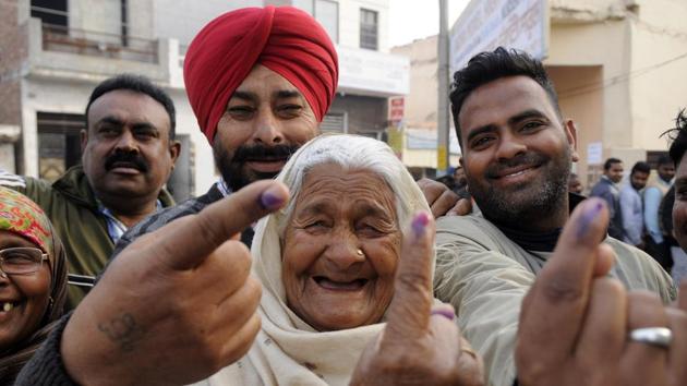 People showing ink mark after casting vote in Patiala on Saturday.(Bharat Bhushan/HT Photo)