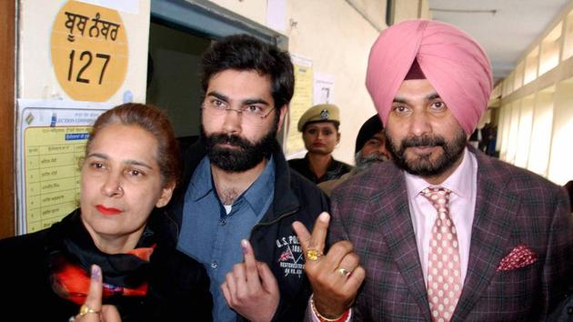 Congress candidate Navjot Singh Sidhu with his wife Navjot Kaur and his son after casting their votes at a polling station in Amritsar on February 4, 2017. (PTI) Congress candidate Navjot Singh Sidhu with his wife Navjot Kaur and his son after casting their votes at a polling station in Amritsar on February 4, 2017. (PTI)