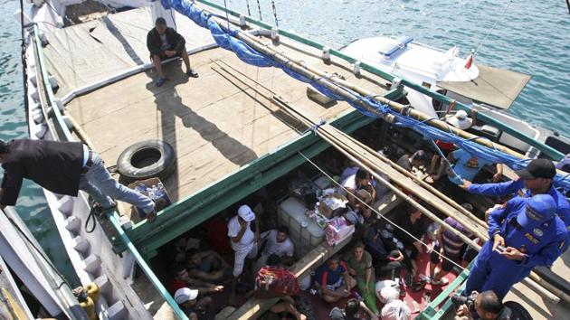 Iranian refugees who were caught in Indonesian waters while sailing to Australia in 2013 sit on a boat at Benoa port in Bali, Indonesia. (AP photo) Iranian refugees who were caught in Indonesian waters while sailing to Australia in 2013 sit on a boat at Benoa port in Bali, Indonesia. (AP photo)