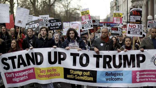 People take part in a protest march in London, against US President Donald Trump's ban on travellers and immigrants from seven predominantly Muslim countries entering the US.(AP photo)