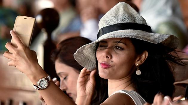 A girl takes a selfie during the derby in Mumbai. (Hindustan Times) 