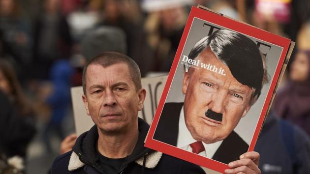 Demonstrators holding placards march in central London during a protest against US President Donald Trump on Saturday. (AFP) Demonstrators holding placards march in central London during a protest against US President Donald Trump on Saturday. (AFP)