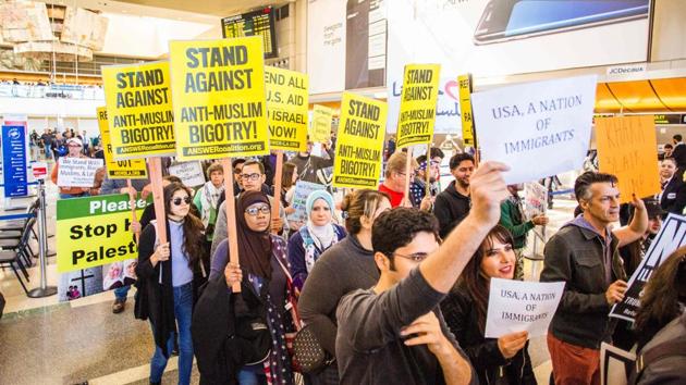 People protest against the executive order by US President Donald Trump, banning immigrants from seven majority-Muslim countries, at Los Angeles International Airport, California.(AFP photo) People protest against the executive order by US President Donald Trump, banning immigrants from seven majority-Muslim countries, at Los Angeles International Airport, California.(AFP photo)