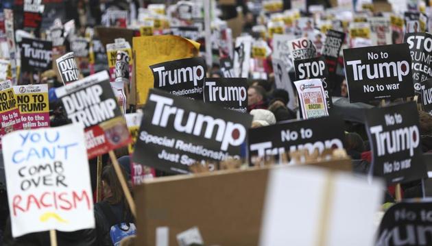 Demonstrators march against US President Donald Trump and his temporary ban on refugees and nationals from seven Muslim-majority countries from entering the United States, during a protest in London.(REUTERS)