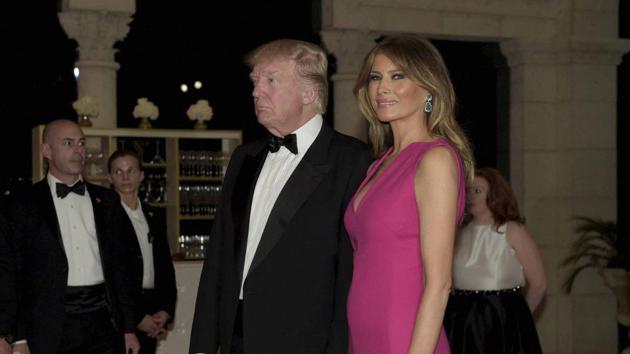 US President Donald Trump and first lady Melania Trump arrive for the 60th annual Red Cross Gala at Trump's Mar-a-Lago resort in Palm Beach, Florida on Saturday.(AP)
