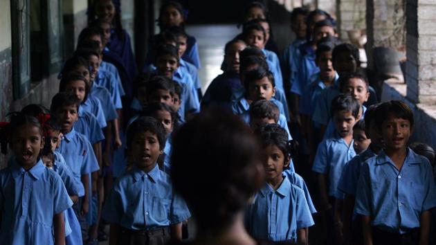Schoolchildren sing national anthem.(HT Photo)