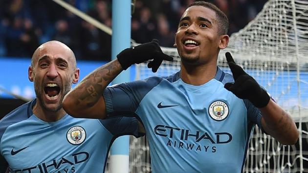 Manchester City's Gabriel Jesus (R) celebrates after scoring their late winning goal against Swansea.(AFP) Manchester City's Gabriel Jesus (R) celebrates after scoring their late winning goal against Swansea.(AFP)