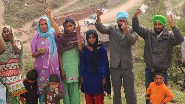 Residents of Masol village showing their inked fingers after casting their vote. (Anil Dayal/HT Photo) Residents of Masol village showing their inked fingers after casting their vote. (Anil Dayal/HT Photo)