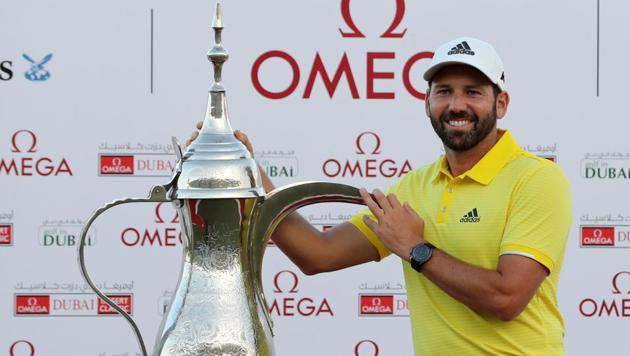 Sergio Garcia of Spain poses with the trophy following the final round of the Omega Dubai Desert Classic.(AFP)
