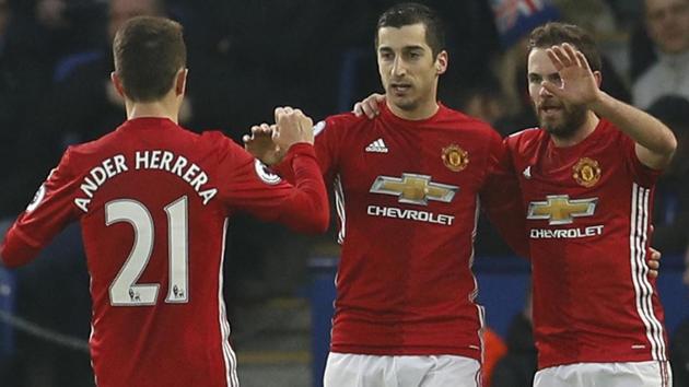 Manchester United's Henrikh Mkhitaryan celebrates scoring their first goal with Ander Herrera and Juan Mata. (REUTERS)