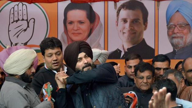 Congress’ Navjot Singh Sidhu with other leaders during a poll campaign for Punjab assembly elections in Amritsar.(PTI Photo)