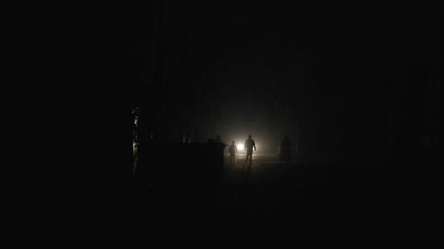 The silhouettes of Syrian men are seen as they walk in the rebel-held town of Douma. (Abd Doumany/AFP)