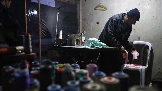 A Syrian tailor works at his workshop. (Abd Doumany/AFP)