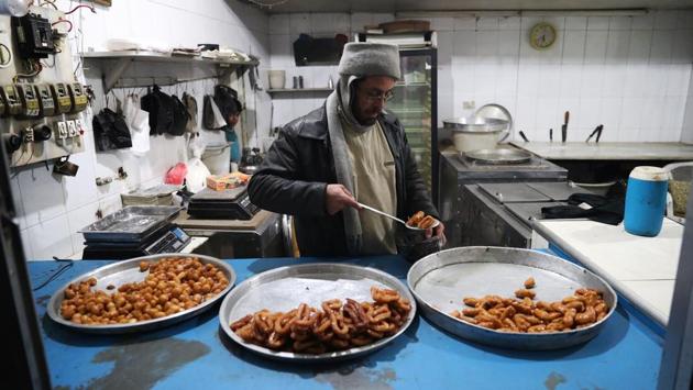 A Syrian man sells sweets in Douma. (Abd Doumany/AFP)