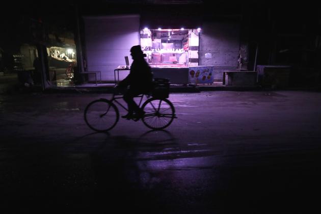 A Syrian man returning home on his bicycle. (Abd Doumany/AFP)