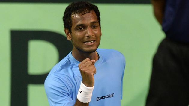 Ramkumar Ramanathan reacts after winning a point during the Davis Cup singles tennis match against New Zealand's Finn Tearney.(AFP)