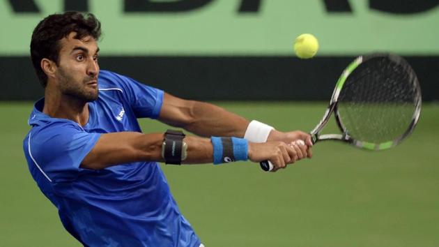 India's Yuki Bhambri returns a shot during the Davis Cup singles tennis match against New Zealand's Jose Statham.(AFP) India's Yuki Bhambri returns a shot during the Davis Cup singles tennis match against New Zealand's Jose Statham.(AFP)
