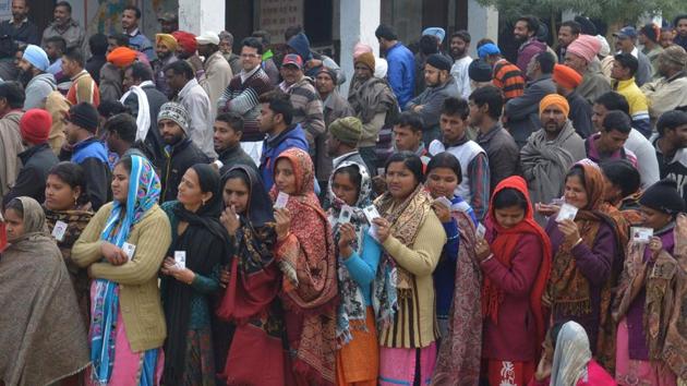 Voters pose for photographers as they queue to at a polling booth in a village on the outskirts of Amritsar. (AFP Photo) Voters pose for photographers as they queue to at a polling booth in a village on the outskirts of Amritsar. (AFP Photo)