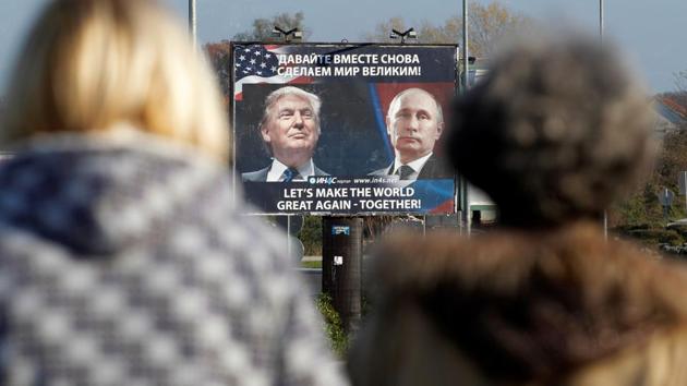 A billboard showing a pictures of US President Donald Trump and Russian President Vladimir Putin is seen through pedestrians in Danilovgrad, Montenegro, in November. (Reuters file photo) A billboard showing a pictures of US President Donald Trump and Russian President Vladimir Putin is seen through pedestrians in Danilovgrad, Montenegro, in November. (Reuters file photo)