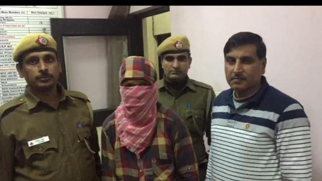 40-year-old Naresh (face covered) in police custody on Monday. (HT Photo) 40-year-old Naresh (face covered) in police custody on Monday. (HT Photo)