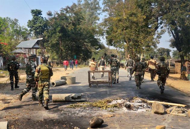 Security personnel patrol as bandh supporters block the highway during a strike call against 33% women’s reservation and killing of two persons in police firing in Dimapur.(PTI)