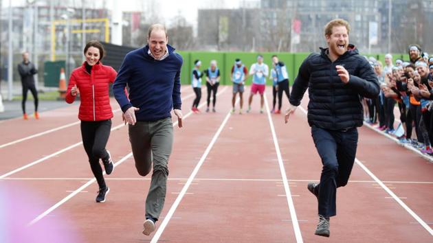 Prince William (second left), his wife Kate, the Duchess of Cambridge, and Prince Harry take part in a relay race during the promotion of a charity Heads Together at the Queen Elizabeth II Park in London. (AP)