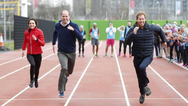 Britain's Prince William (second left), Kate, the Duchess of Cambridge (left), and Prince Harry take part in a race during the promotion of the charity Heads Together at the Queen Elizabeth II Park in London on Sunday. (AP)